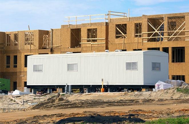 workers studying blueprints in a temporary rental office in Zephyrhills FL